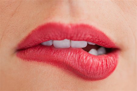 Close-up of an attractive woman biting her beautiful lips Stock Photo - Budget Royalty-Free & Subscription, Code: 400-06691105