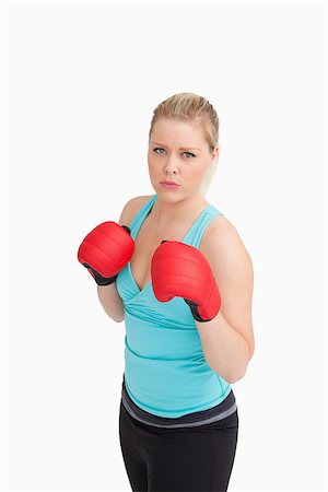 simsearch:400-06876600,k - Woman wearing sportswear and gloves against white background Stock Photo - Budget Royalty-Free & Subscription, Code: 400-06691464