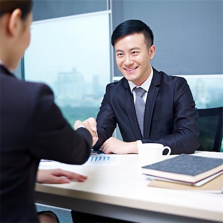 asian business executives shaking hands in office. Stock Photo - Budget Royalty-Free & Subscription, Code: 400-06691795