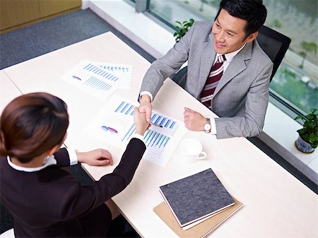 asian business executives shaking hands in office, high angle view. Stock Photo - Budget Royalty-Free & Subscription, Code: 400-06691797