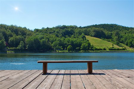 Wooden bench looking at the lake and forest Stock Photo - Budget Royalty-Free & Subscription, Code: 400-06692460