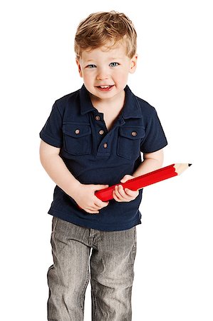 simsearch:400-06950074,k - Cute boy holding a big pencil looking happy on a studio white background. Photographie de stock - Aubaine LD & Abonnement, Code: 400-06692515