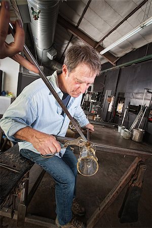Mature European man shaping a newly created glass object Stock Photo - Budget Royalty-Free & Subscription, Code: 400-06692576