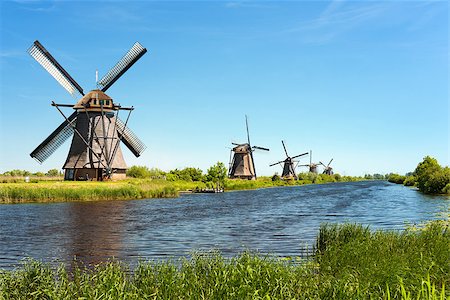 A windmills at Kinderdijk. Foto de stock - Super Valor sin royalties y Suscripción, Código: 400-06692834