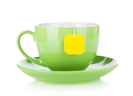 simsearch:400-04476908,k - Green tea cup and teabag. Isolated on white background Stock Photo - Budget Royalty-Free & Subscription, Code: 400-06700435