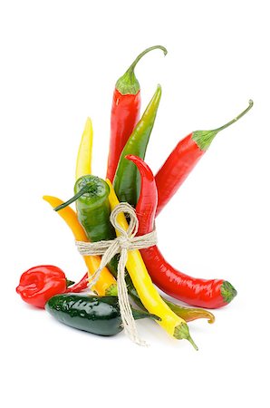 simsearch:400-07515420,k - Bunch of Chili Peppers with Yellow Santa Fee, Red Habanero, Green Jalapeno, Green and Red Peppers isolated on white background Photographie de stock - Aubaine LD & Abonnement, Code: 400-06700704