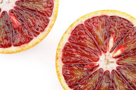 simsearch:400-08012355,k - Two Blood Oranges in Half closeup on white background Photographie de stock - Aubaine LD & Abonnement, Code: 400-06700703