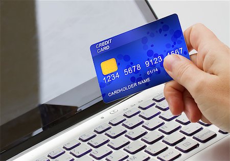 people in line to bank - hand holding plastic card  on open notebook background Stock Photo - Budget Royalty-Free & Subscription, Code: 400-06700896