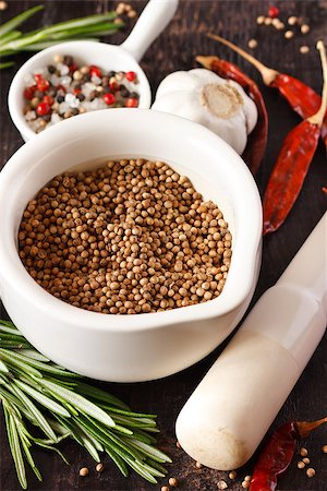 simsearch:400-04846756,k - Coriander seeds in a white mortar with spices. Stock Photo - Budget Royalty-Free & Subscription, Code: 400-06700957