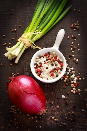 Fresh chives, red onion and salt with colorful peppercorns on a dark wooden background. Stock Photo - Budget Royalty-Free & Subscription, Code: 400-06700963
