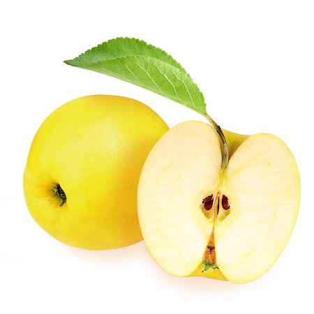 simsearch:400-04994957,k - Whole and half of yellow apples with one green leaf on white background. Close-up. Studio photography. Foto de stock - Super Valor sin royalties y Suscripción, Código: 400-06701014