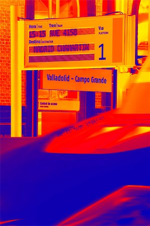 Signpost on a train station orange and blue Foto de stock - Royalty-Free Super Valor e Assinatura, Número: 400-06701061