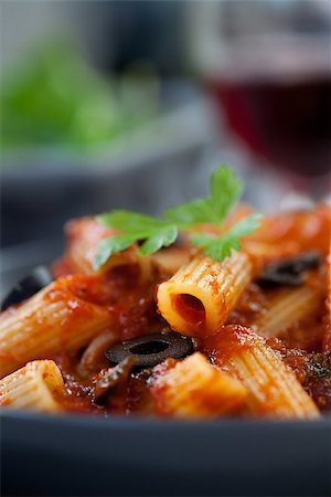 simsearch:400-04532905,k - Italian food. Pasta penne with tomato sauce, olives and garnish Photographie de stock - Aubaine LD & Abonnement, Code: 400-06701259