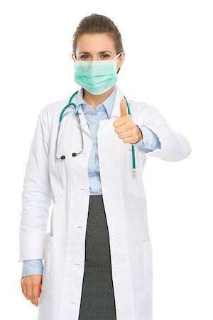 Medical doctor woman in mask showing thumbs up Stock Photo - Budget Royalty-Free & Subscription, Code: 400-06701618