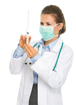 doctor preparing shot - Medical doctor woman in mask with syringe preparing injection Stock Photo - Budget Royalty-Free & Subscription, Code: 400-06701619