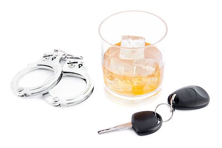 simsearch:400-05195371,k - Handcuff a whiskey and a car key against a white background Stockbilder - Microstock & Abonnement, Bildnummer: 400-06734051