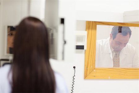 Doctor conducting a radiography in an examination room Stock Photo - Budget Royalty-Free & Subscription, Code: 400-06734134