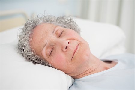 Patient sleeping on a medical bed in hospital ward Stock Photo - Budget Royalty-Free & Subscription, Code: 400-06734205