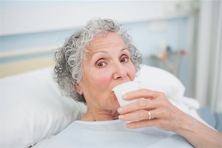 Elderly patient drinking in hospital ward Stock Photo - Budget Royalty-Free & Subscription, Code: 400-06734202