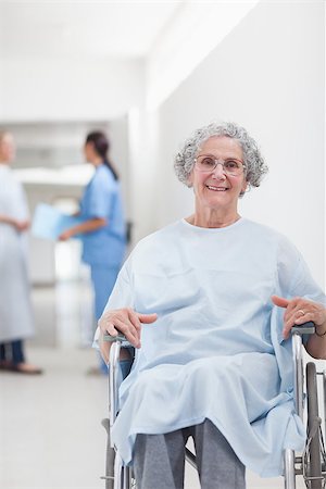 simsearch:400-07337135,k - Elderly patient in a wheelchair in a corridor in hospital ward Stock Photo - Budget Royalty-Free & Subscription, Code: 400-06734425
