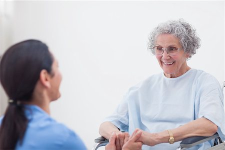 simsearch:400-07337135,k - Nurse holding hands of a patient in hospital ward Stock Photo - Budget Royalty-Free & Subscription, Code: 400-06734420