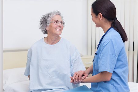 Nurse comforting a patient in hospital ward Stock Photo - Budget Royalty-Free & Subscription, Code: 400-06734439