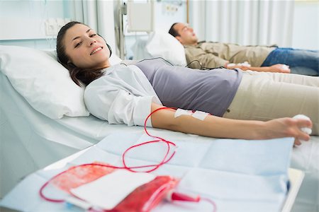 simsearch:400-06734658,k - Patients receiving a transfusion in hospital ward Stock Photo - Budget Royalty-Free & Subscription, Code: 400-06734589