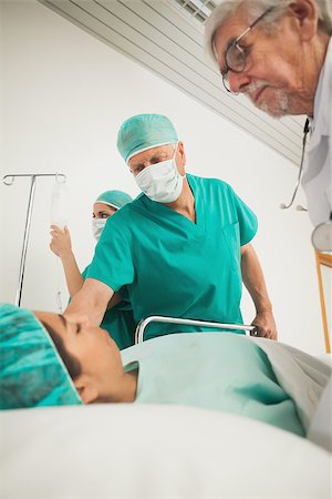 simsearch:400-06734621,k - Doctor looking at a female patient in hospital corridor Stock Photo - Budget Royalty-Free & Subscription, Code: 400-06734619