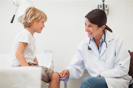 simsearch:400-06734647,k - Female doctor auscultating a child in examination room Stock Photo - Budget Royalty-Free & Subscription, Code: 400-06734653