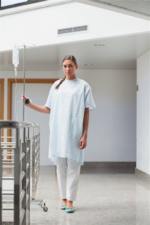 patient walking hospital halls - Patient walking with a drip stand in hospital hallway Foto de stock - Super Valor sin royalties y Suscripción, Código: 400-06734671