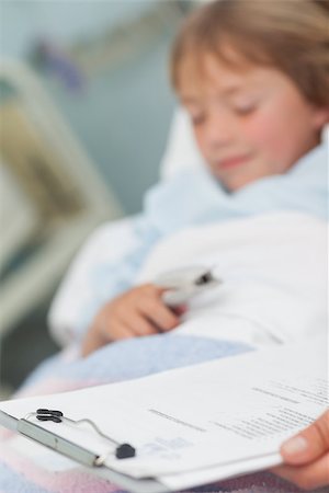 Focus on medical result next to a child in hospital ward Stock Photo - Budget Royalty-Free & Subscription, Code: 400-06734734