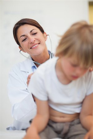 simsearch:400-06734647,k - Doctor examining breathing of a child with a stethoscope in examination room Stock Photo - Budget Royalty-Free & Subscription, Code: 400-06734738