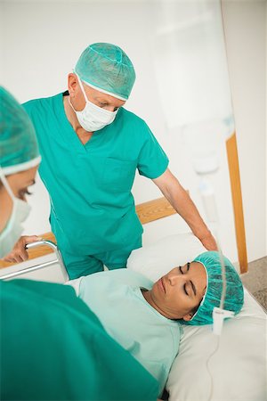 patient on bed and iv - Asleep female patient on a bed in hospital corridor Stock Photo - Budget Royalty-Free & Subscription, Code: 400-06734790