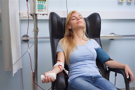 donation - Patient receiving a transfusion while listening music in hospital ward Stock Photo - Budget Royalty-Free & Subscription, Code: 400-06734873