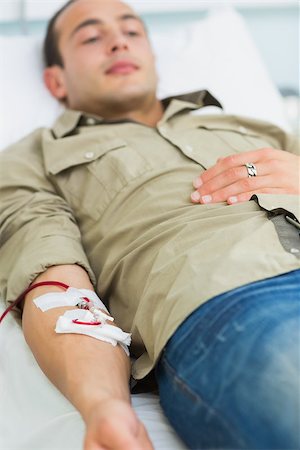 donation - Male transfused lying on a bed in hospital ward Stock Photo - Budget Royalty-Free & Subscription, Code: 400-06734880