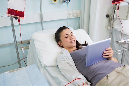 photo of patient in hospital in usa - Female patient holding a tablet computer in hospital ward Stock Photo - Budget Royalty-Free & Subscription, Code: 400-06734977