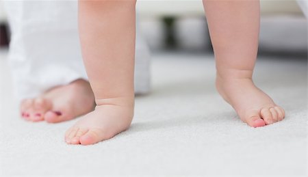 feet walking indoors - Close up of the baby feet in living room Stock Photo - Budget Royalty-Free & Subscription, Code: 400-06735065