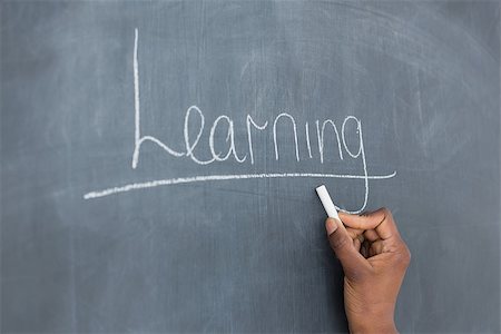 Someone showing the blackboard in a classroom Stock Photo - Budget Royalty-Free & Subscription, Code: 400-06735372