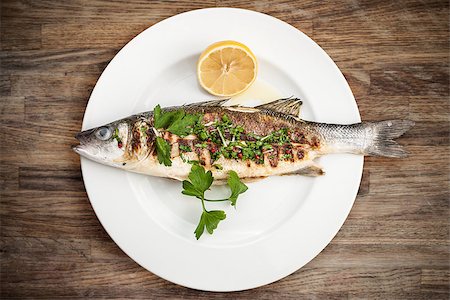 Grilled sea bass on a plate Stock Photo - Budget Royalty-Free & Subscription, Code: 400-06735647