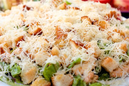 Caesar salad on a plate sprinkled with grated cheese Stockbilder - Microstock & Abonnement, Bildnummer: 400-06735656