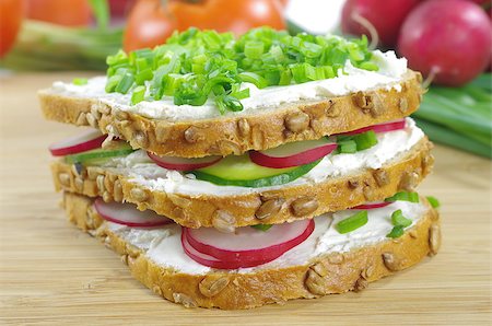 quark cheese with vegetables - three slices of bread with cottage cheese and the vegetables Stock Photo - Budget Royalty-Free & Subscription, Code: 400-06736281