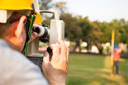 simsearch:400-07304331,k - Surveyor engineer with partner making measure on the field Stock Photo - Budget Royalty-Free & Subscription, Code: 400-06736413