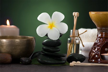 essence - tropical frangipani spa health treatment with aroma therapy and hot stones, shot with ambient lights Stock Photo - Budget Royalty-Free & Subscription, Code: 400-06736546