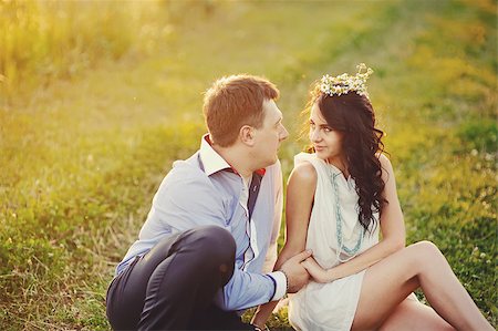 romantic couple embraces in the field Stock Photo - Budget Royalty-Free & Subscription, Code: 400-06737038