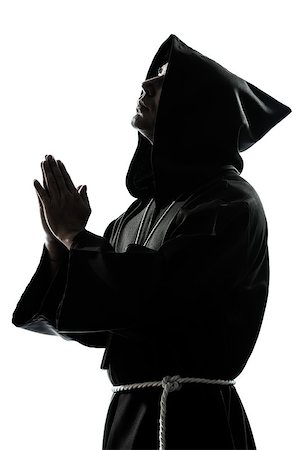simsearch:614-02764159,k - one caucasian man priest praying silhouette in studio isolated on white background Stockbilder - Microstock & Abonnement, Bildnummer: 400-06737839