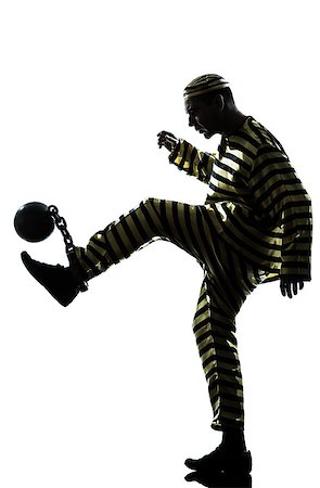 robber full body - one caucasian man prisoner criminal playing soccer with chain ball in studio isolated on white background Stock Photo - Budget Royalty-Free & Subscription, Code: 400-06737844