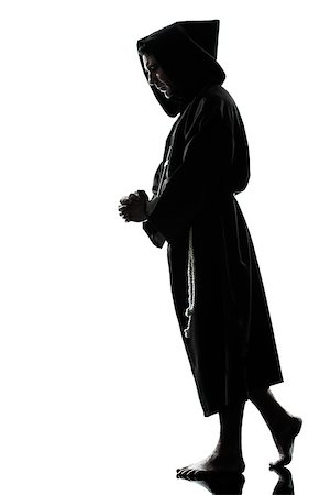 simsearch:614-02764159,k - one caucasian man priest praying silhouette in studio isolated on white background Stockbilder - Microstock & Abonnement, Bildnummer: 400-06737841