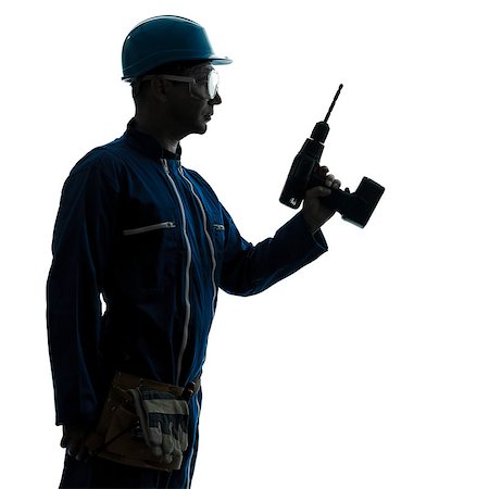 silhouette as carpenter - one caucasian man construction worker holding drill silhouette in studio on white background Stock Photo - Budget Royalty-Free & Subscription, Code: 400-06737860