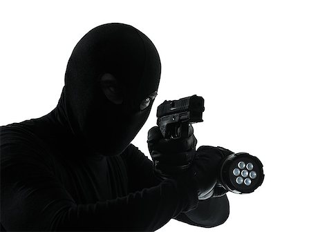 shadow man holding gun - thief criminal in silhouette studio isolated on white background Stock Photo - Budget Royalty-Free & Subscription, Code: 400-06737996