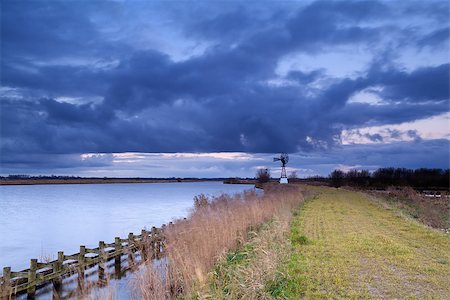 simsearch:400-07046539,k - metal modern windmill by lake during storm Stock Photo - Budget Royalty-Free & Subscription, Code: 400-06738050